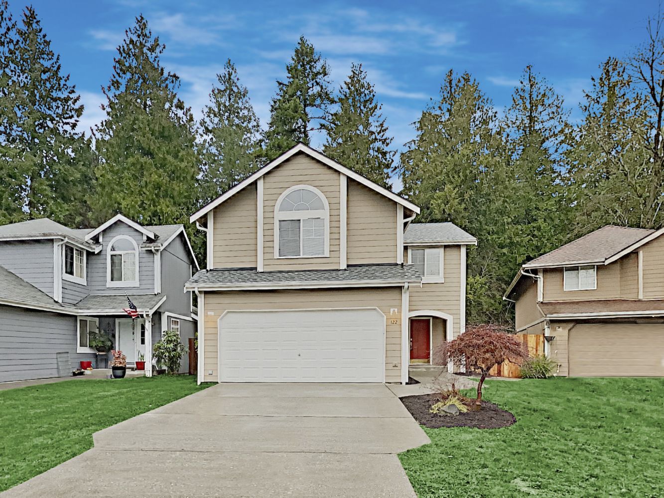 House featuring a two-car garage and covered porch at Invitation Homes Seattle.