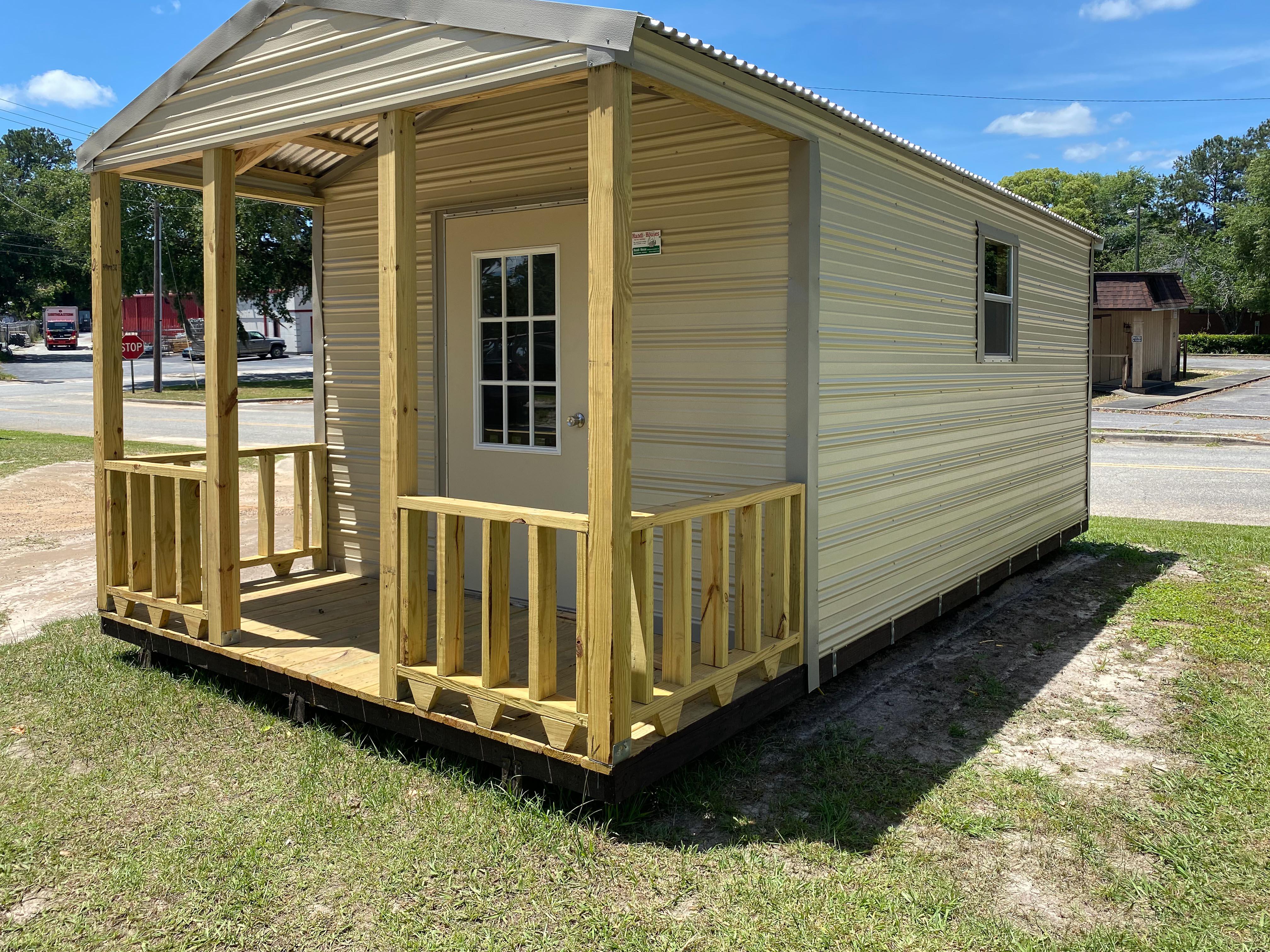 Portable shed with door and window and porch