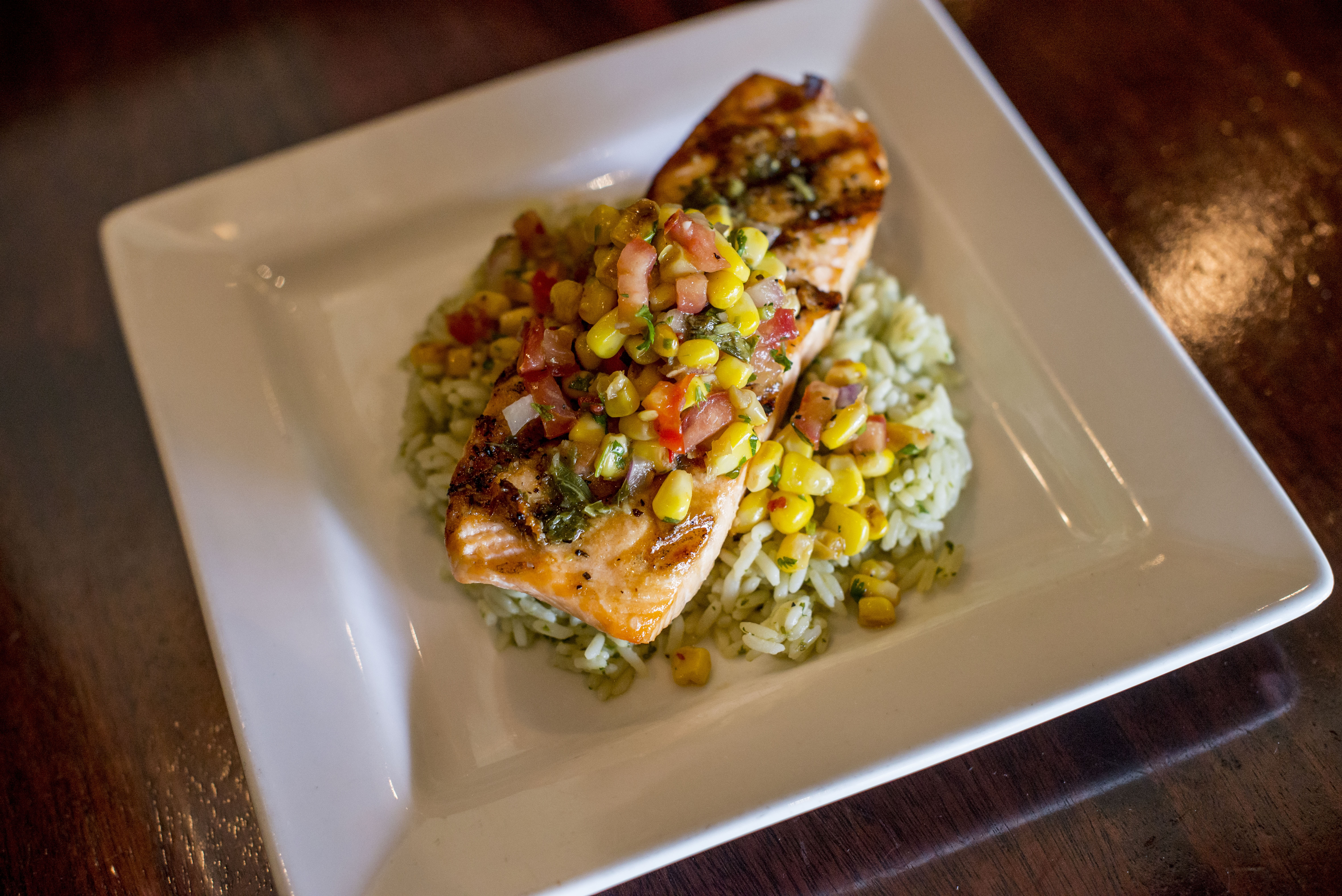 Grilled Salmon: herbed rice, roasted corn salsa, basil oil