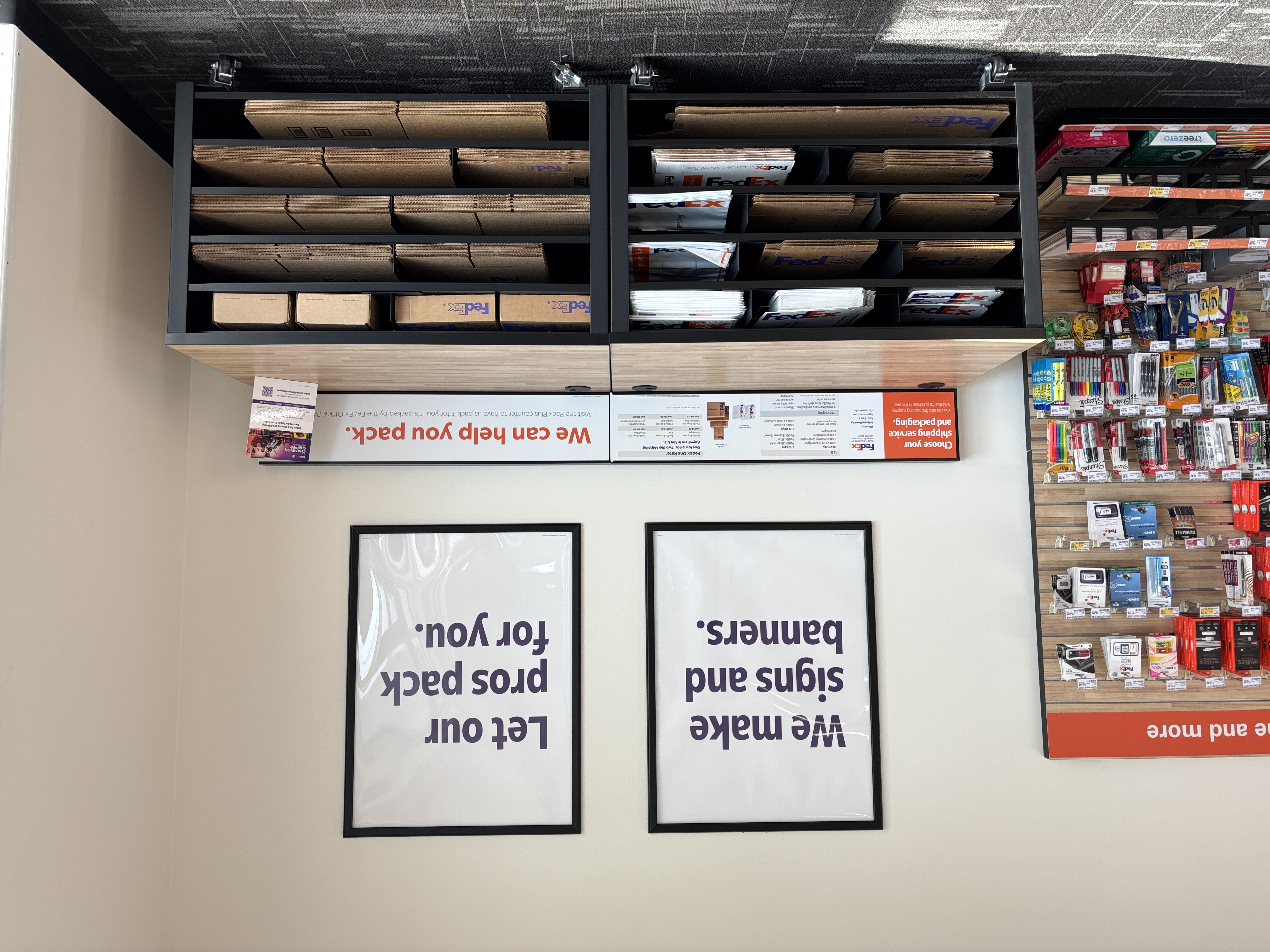 A self-service station featuring a wide assortment of FedEx Express boxes, envelopes, and mailers for all shipping needs.