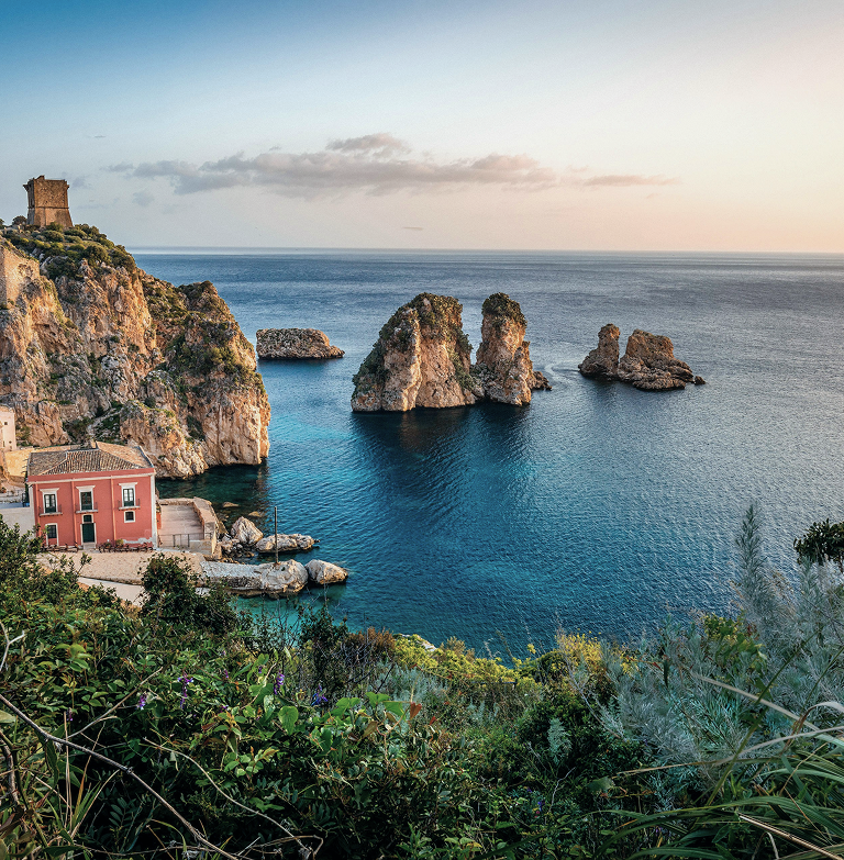 A scenic view of the coastal village of Scopello in Italy.