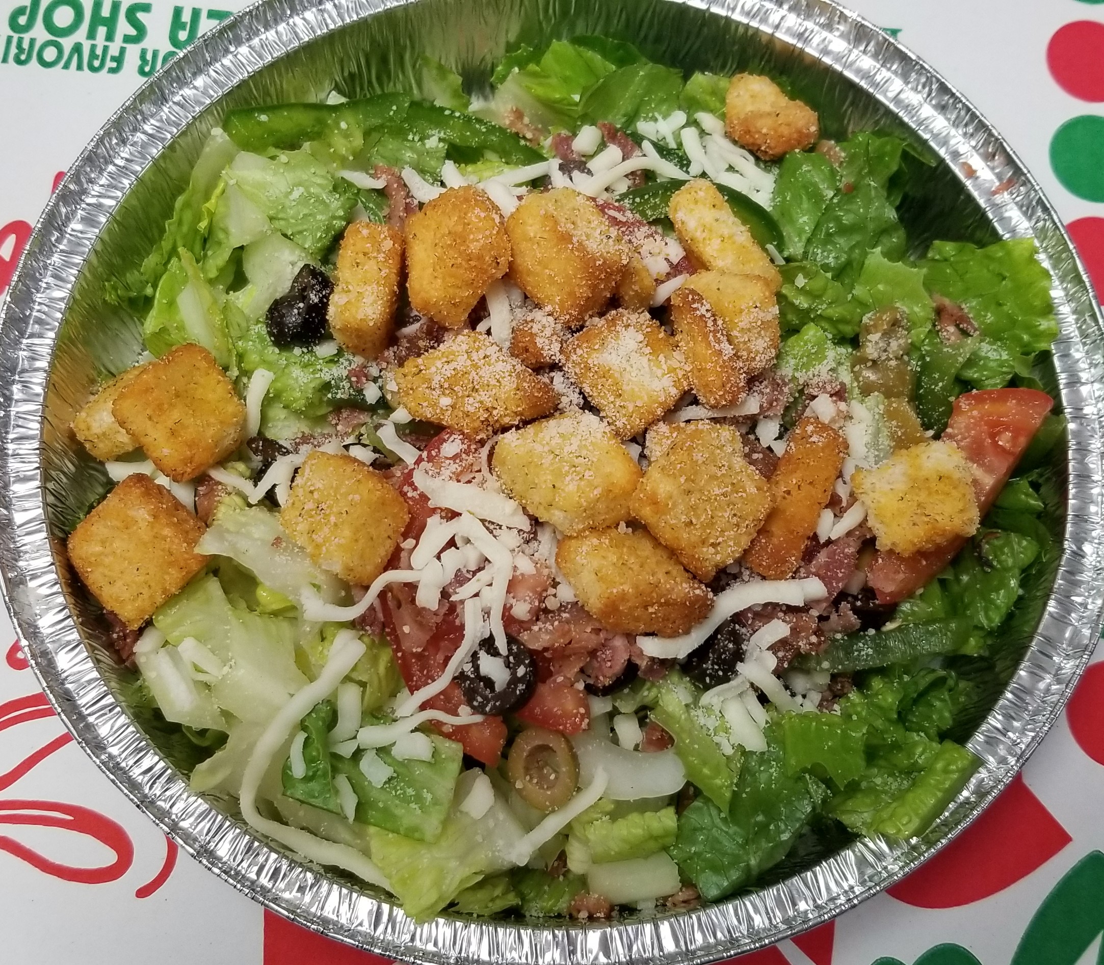 Dan's House Caesar Salad loaded with veggies, cheese and croutons!