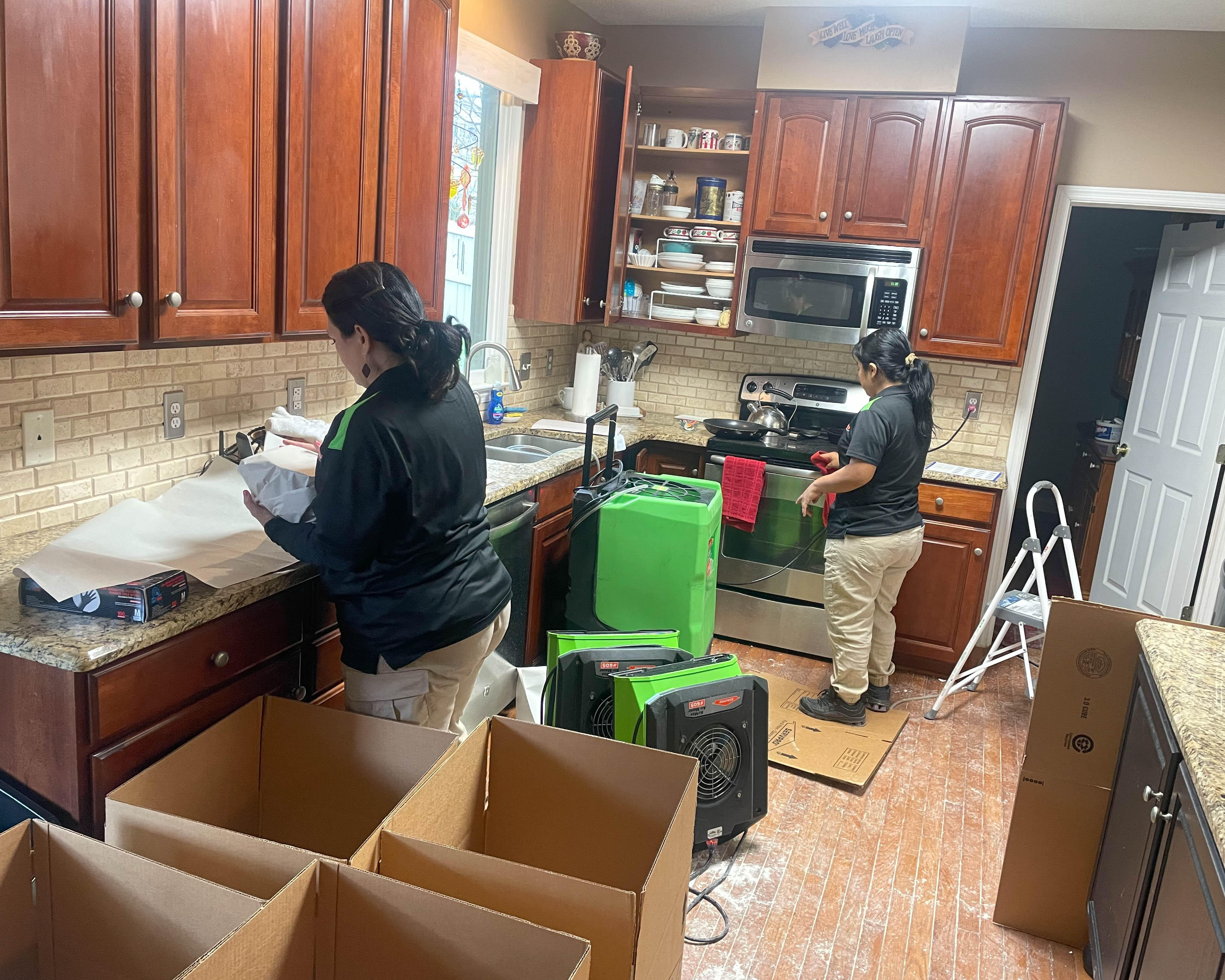 Due to the amount of moisture in this kitchen area, our staff need it to remove everything in order to start the drying process.