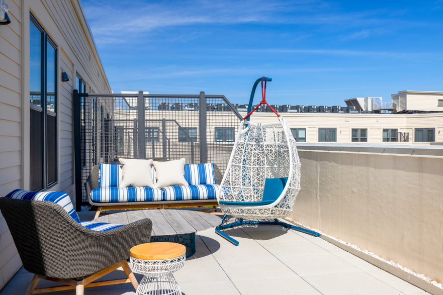 Step outside and soak up the sun from the Rooftop Lounges' private balcony.