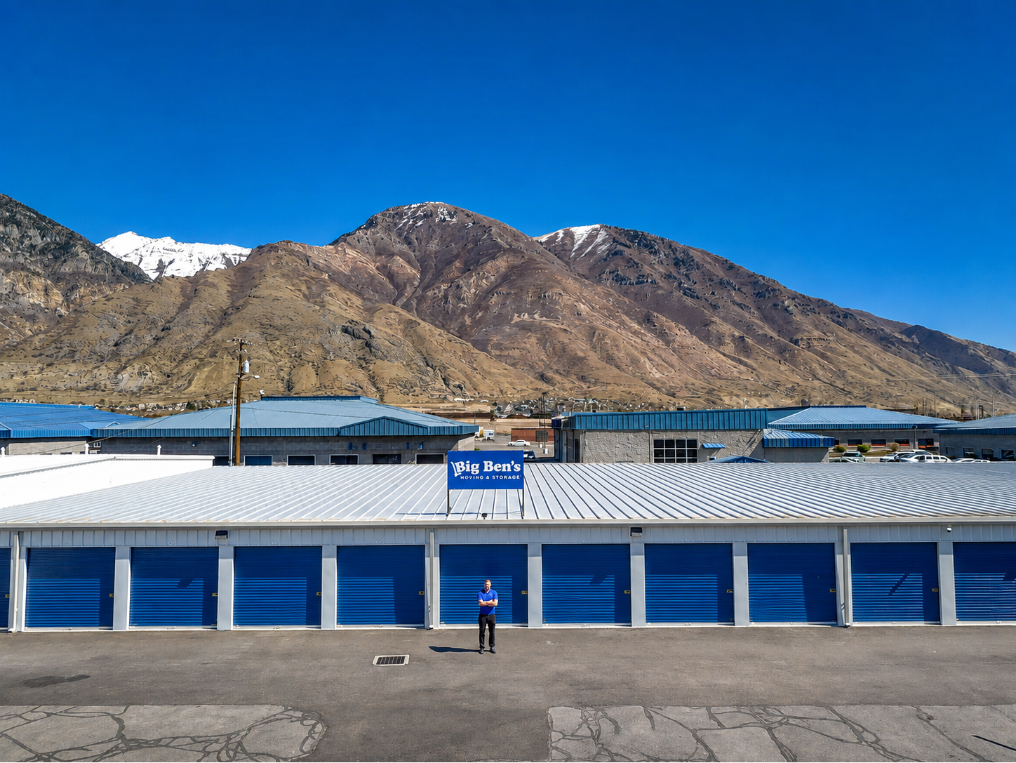 Exterior view of Big Ben’s Storage in Provo, Utah, featuring rows of blue drive-up storage units, fa 