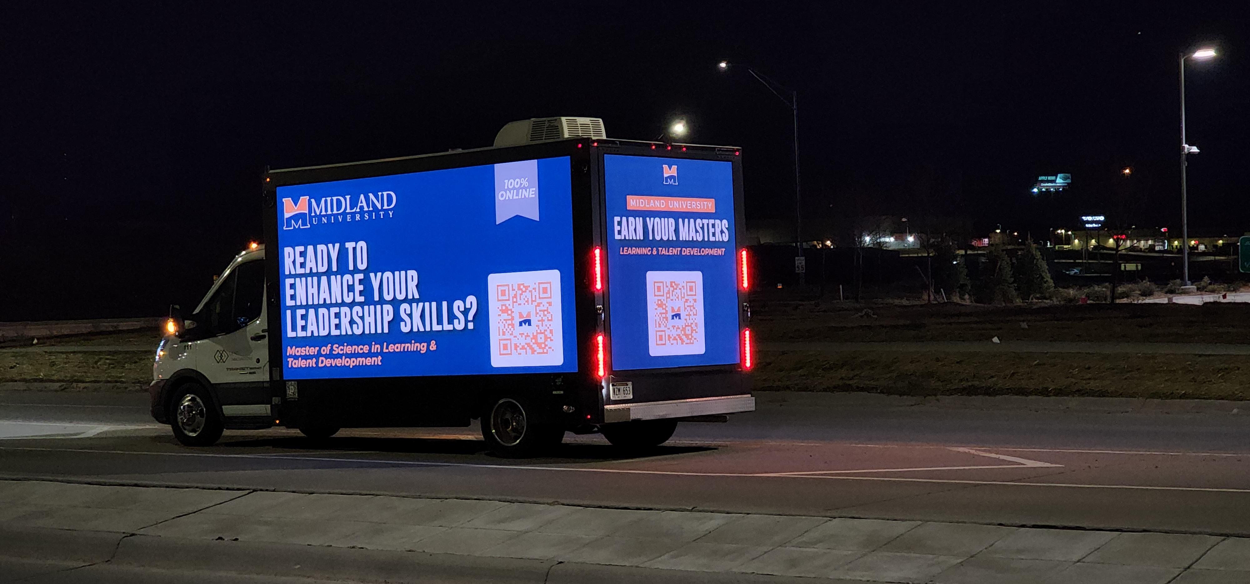 Lead Innovations mobile digital billboard truck in Omaha NE with with advertisement for Midlands University