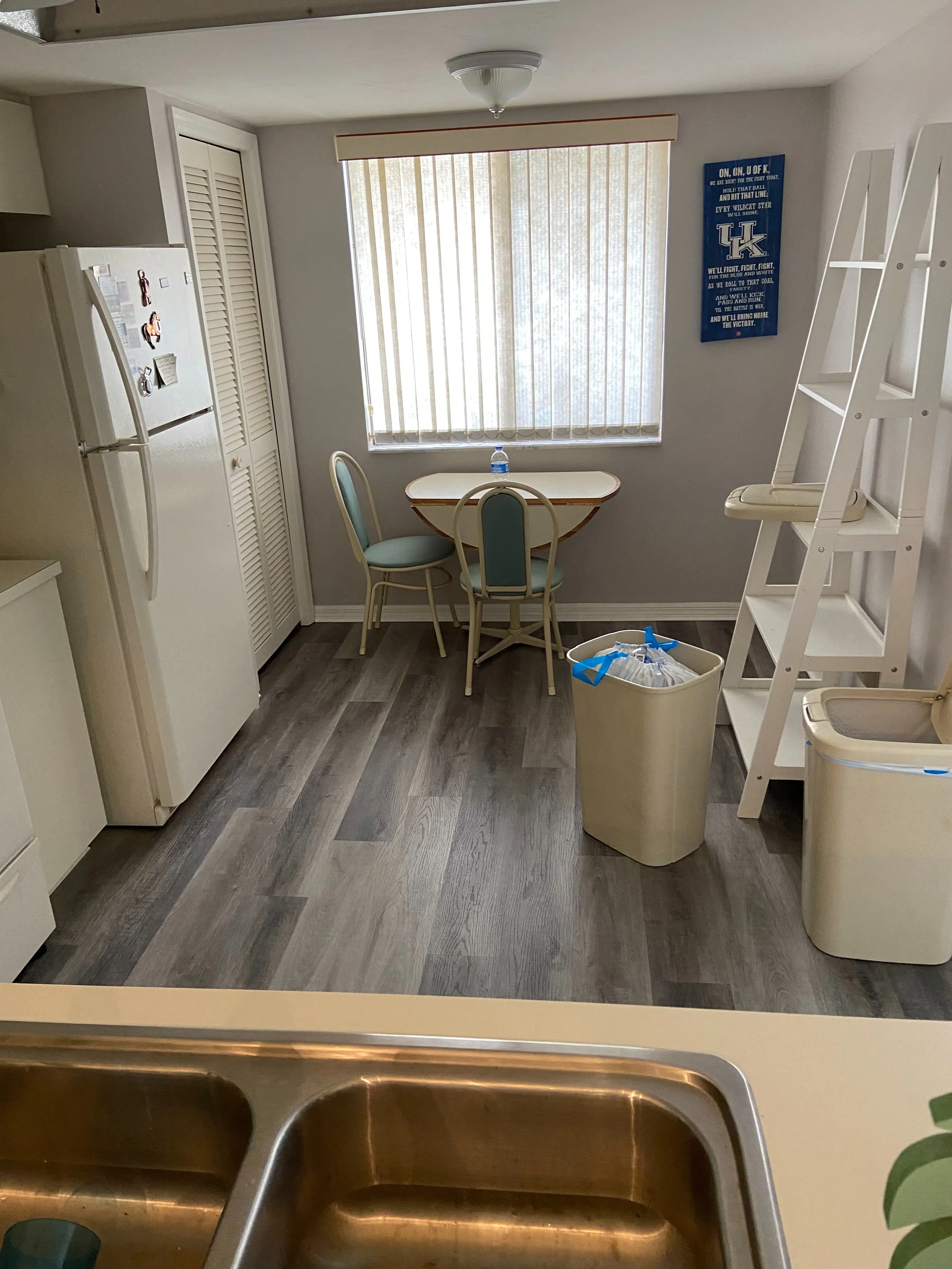 Completed wood-look porcelain tile flooring installation with a clean plank layout. 