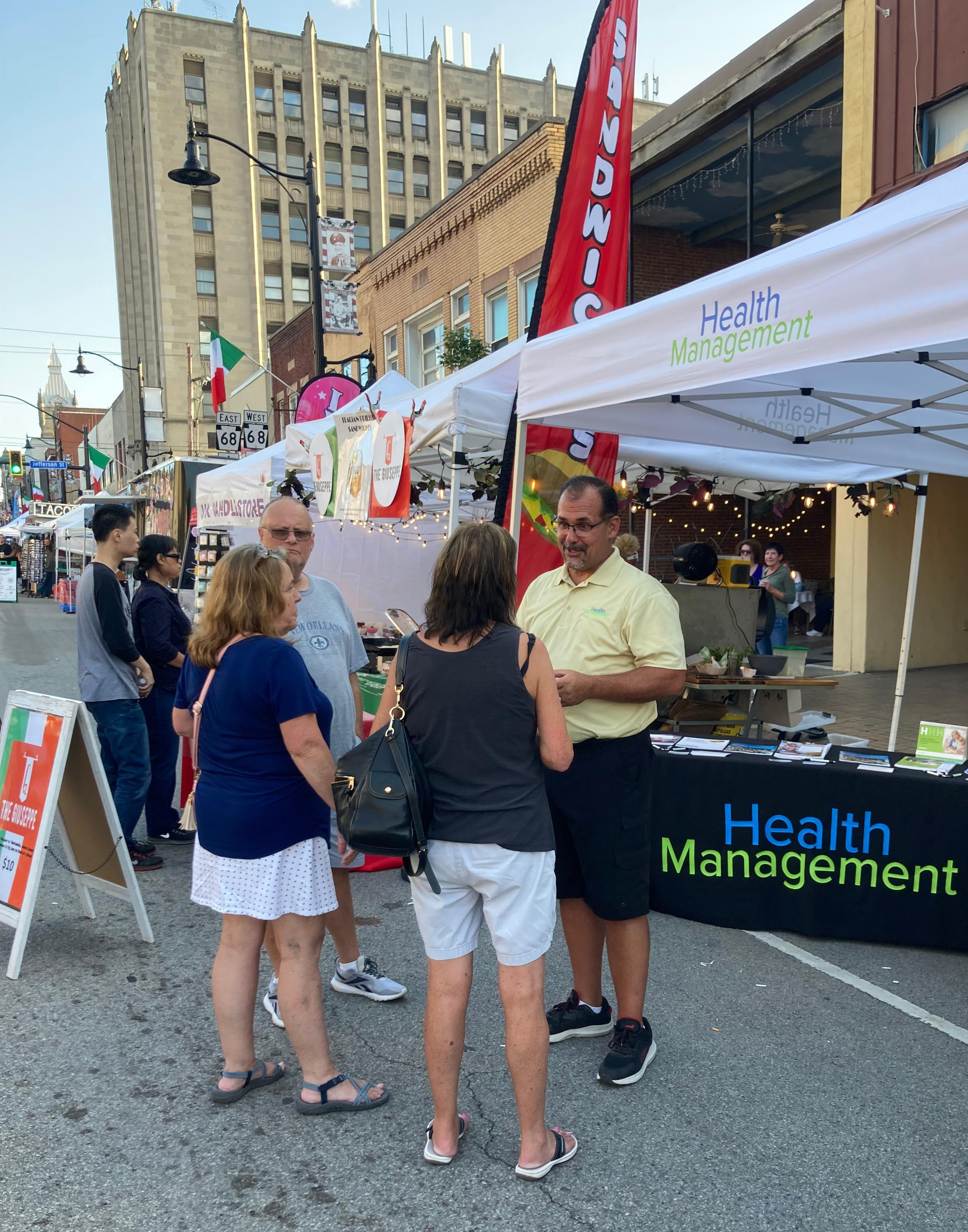 Tim Powers speaking with potential clients at the Italian Festival in Butler PA.