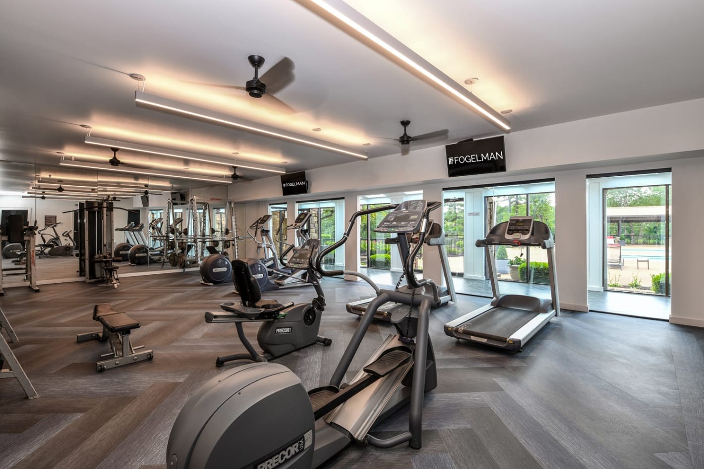 Renovated fitness studio with cardio and weight lifting equipment at 15Seventy