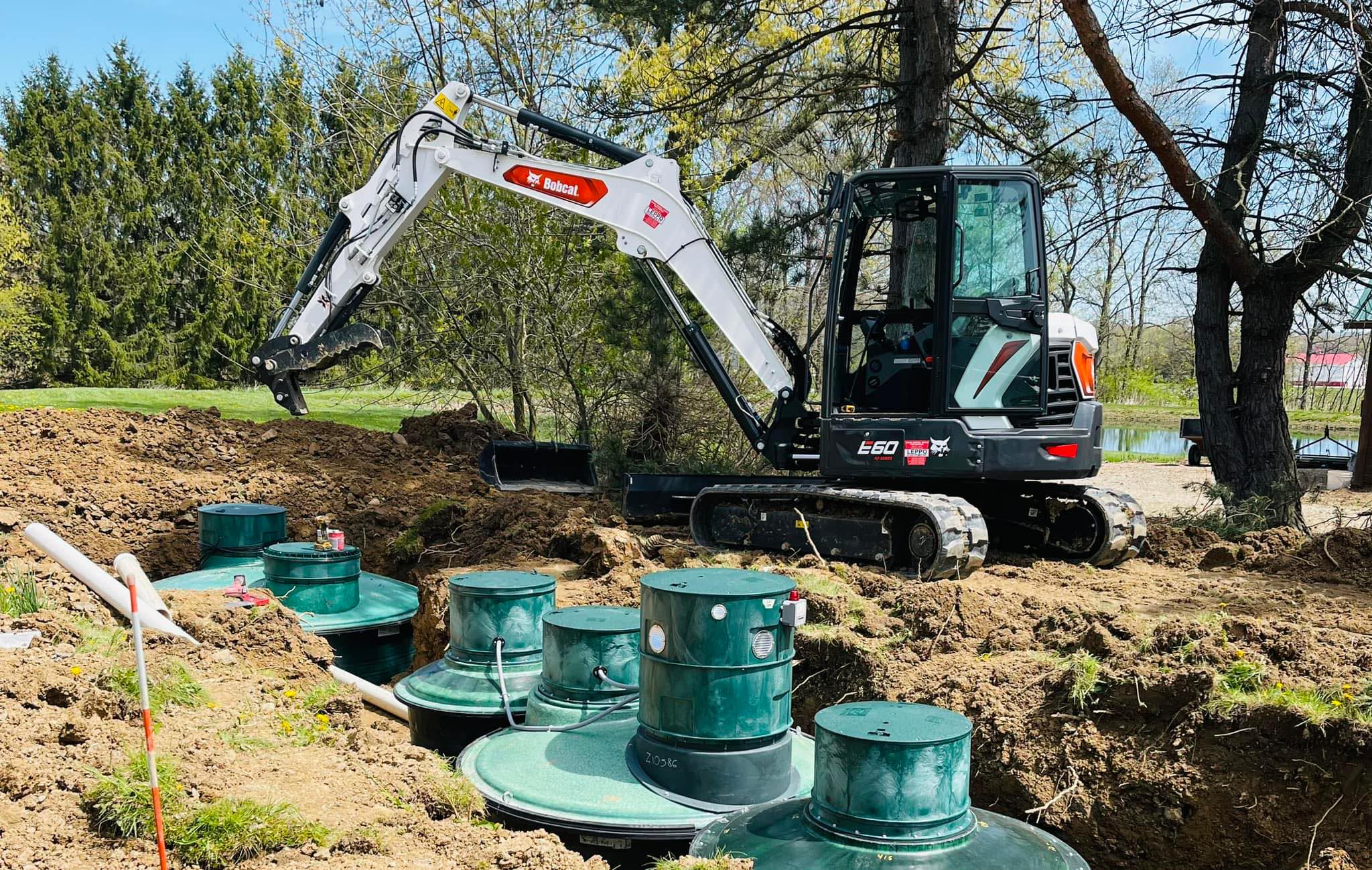 Earthworks handles anything that requires a shovel and machine to move dirt—from septic and sewers, to land clearing, pond installation, basement waterproofing, new build and demolition.