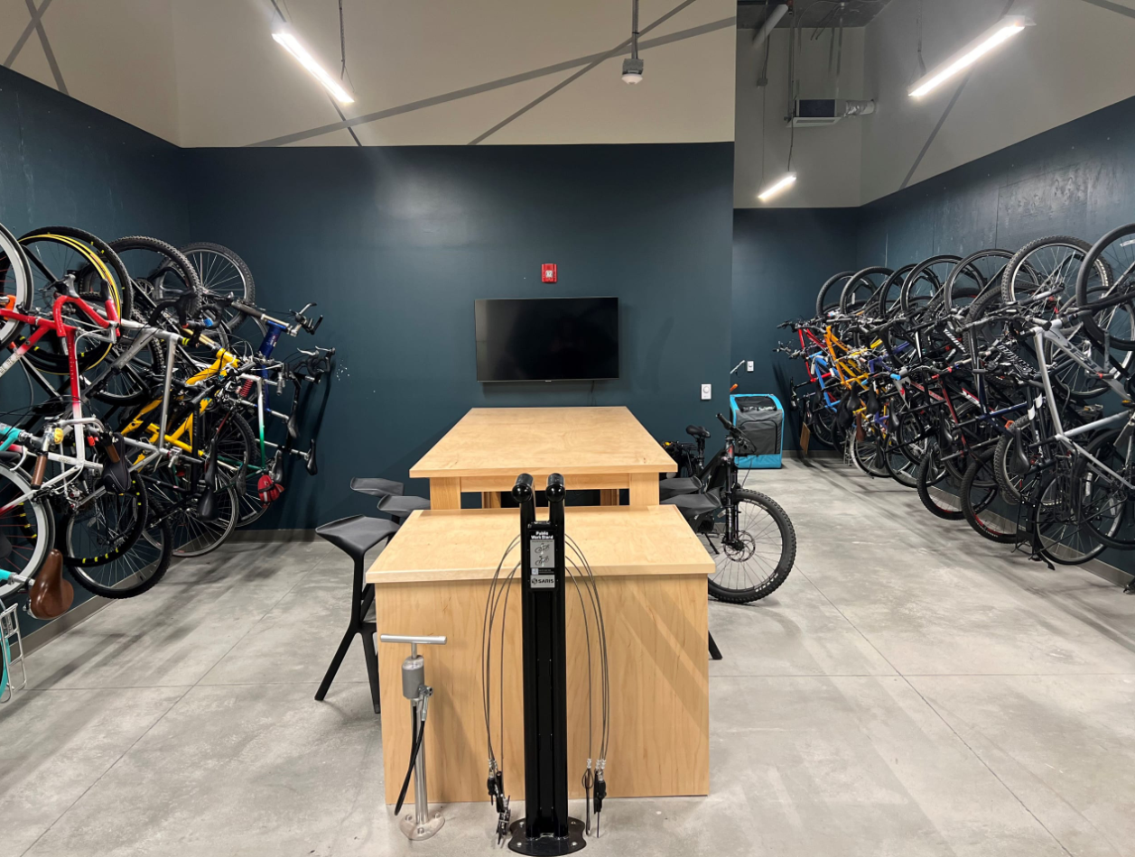 Bike storage room with fix it station and television