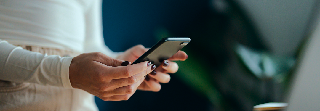 Close-up of a person examining their phone.