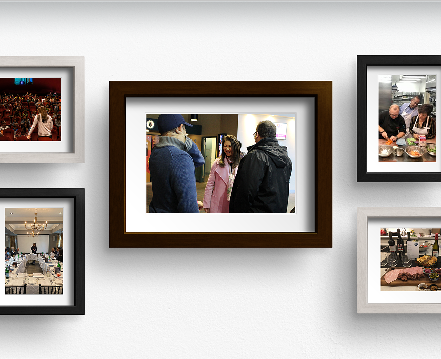 Gallery wall with memories featuring members of the Yvonne Chan Family Wealth team.