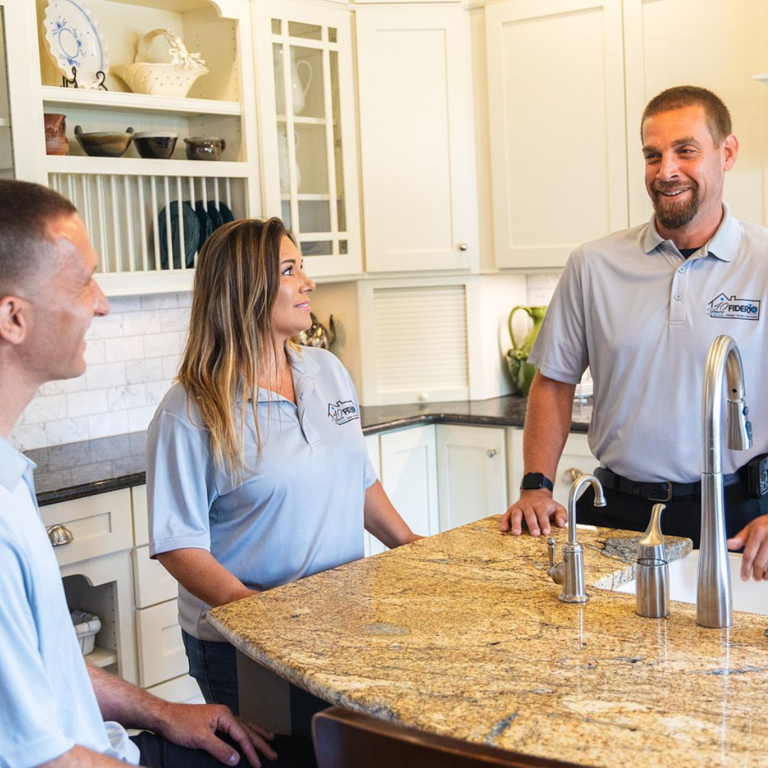 Fiderio & Sons team discusses a kitchen renovation project on-site.