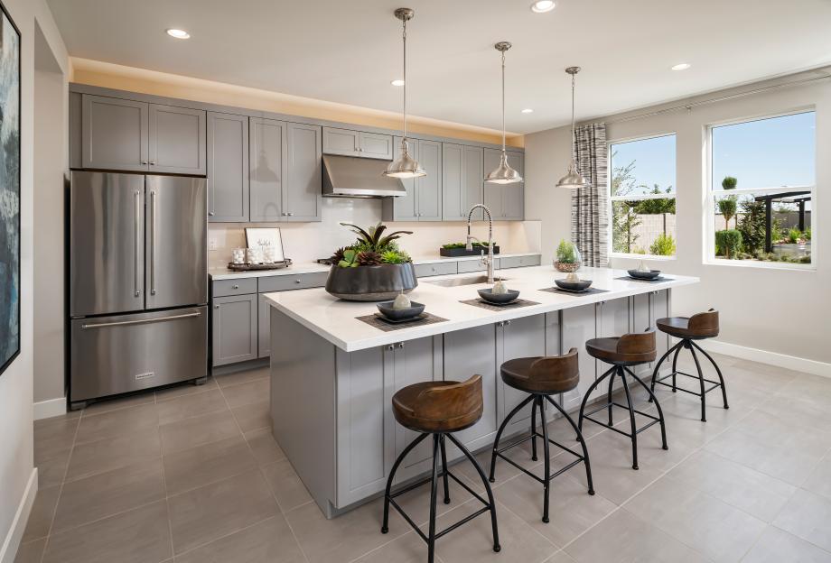 Well-appointed kitchens feature large center islands and stainless steel appliances