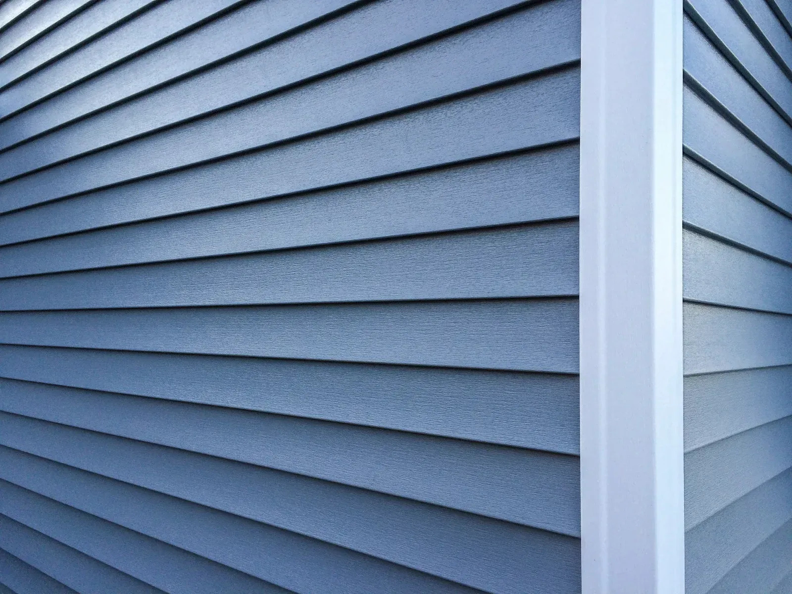 Close-up of premium vinyl siding showcasing clean installation, smooth finishes, and low-maintenance performance. The exterior material enhances home protection, energy efficiency, and curb appeal.