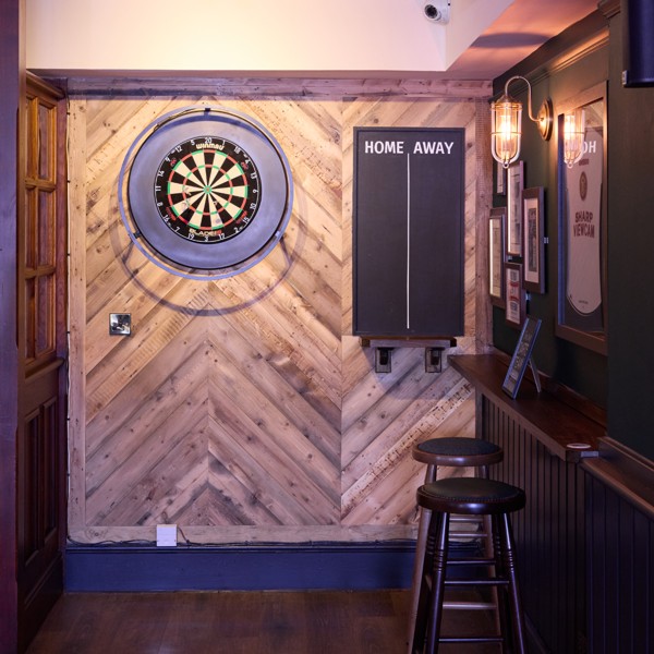 Dedicated darts area offering guests a traditional pub games experience.