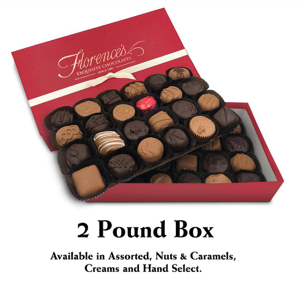 A luxurious 2-pound box of Florence's Exquisite Chocolates, located in Rexburg, Idaho. The box features an elegant assortment of handcrafted chocolates, including caramels, nut-filled pieces, creams, and truffles. Perfect for gifting or indulging in a premium chocolate experience.