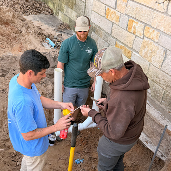 A&J Plumbing and Construction crew working in septic tank in emory texas 