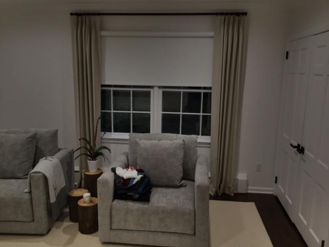 Let our skilled installation team transform your home with the perfect window treatments. We love the beautiful job they did on the Roller Shades and Drapery Panels combination in this Tarrytown, NY, home. #BudgetBlindsOssining #TarrytownNY #RollerShades #DraperyPanels #FreeConsultation #WindowWedne