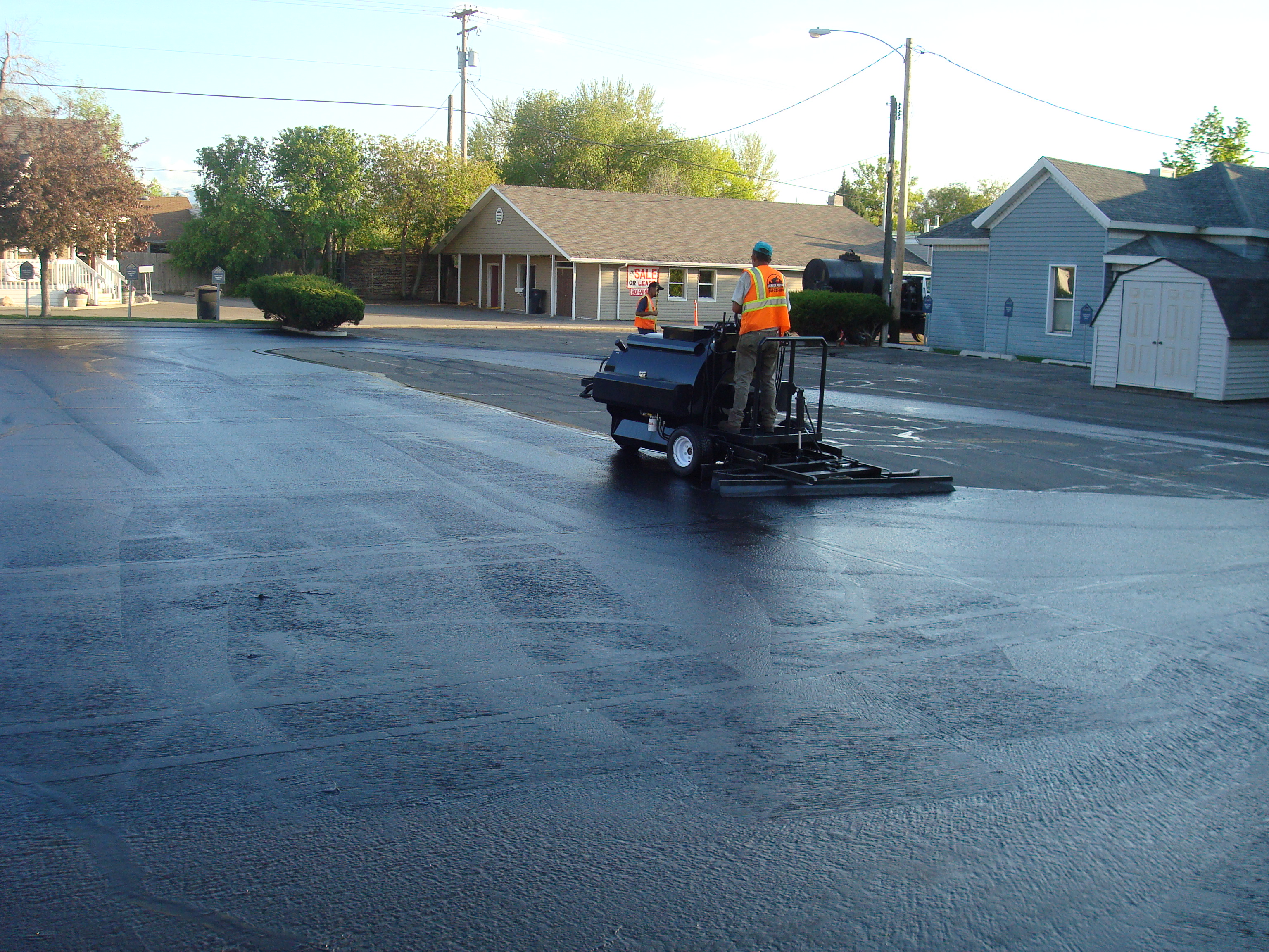 Professional asphalt sealcoating application completed by Eckles Paving serving Cache Valley Utah
