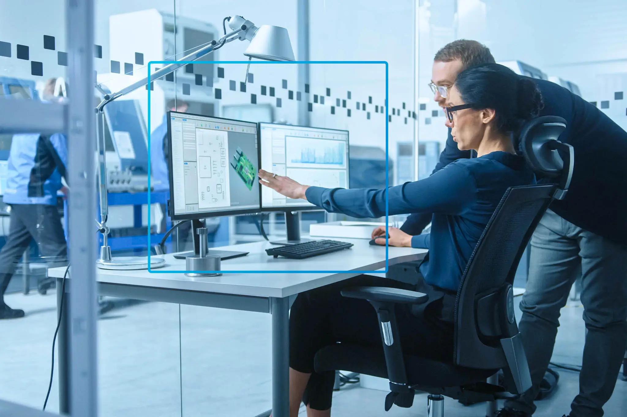 Two colleagues are working together in modern workplace