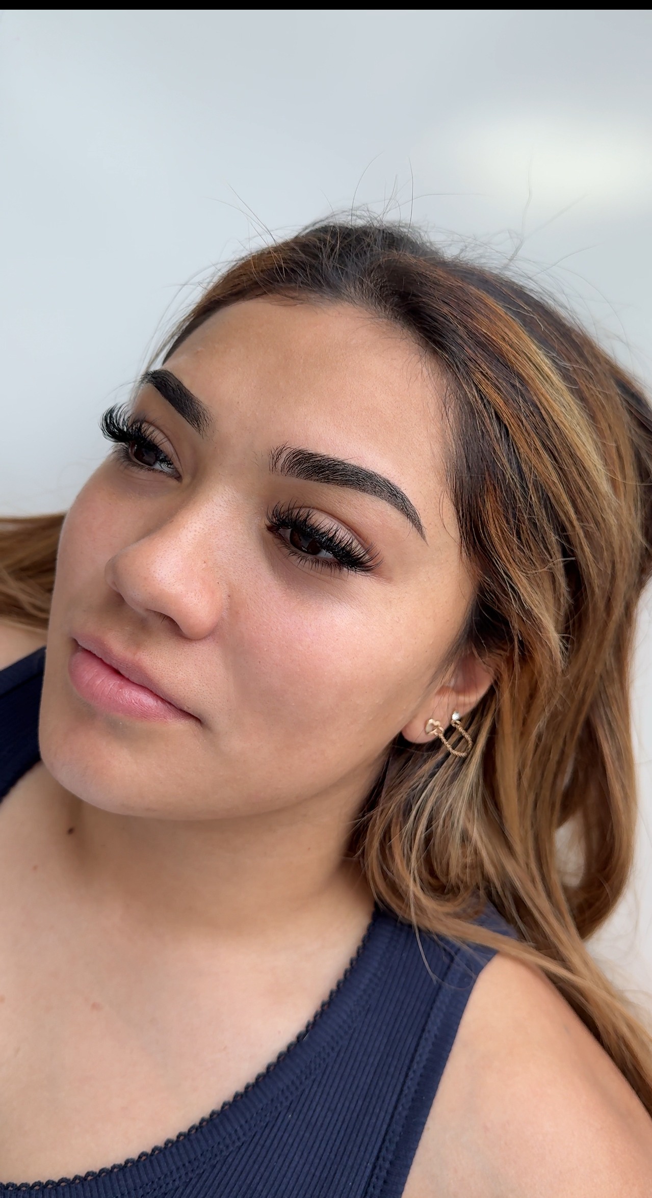 Detailed photo of custom ombr&eacute; brows, designed by a Utah PMU artist for a bold yet elegant shaded style."