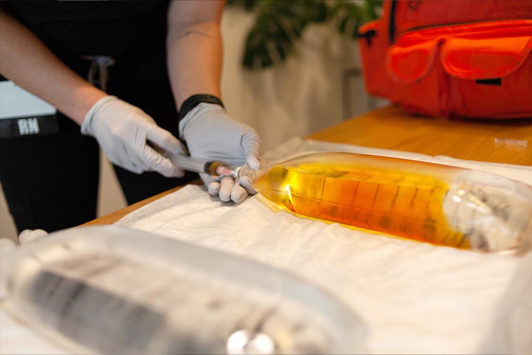 Mobile IV therapy nurse preparing a vitamin infusion drip in Los Angeles