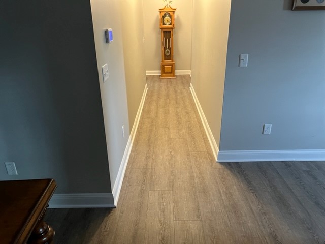 Wood grain LVP installed in Dobson after a water damage ruined the previous flooring.
