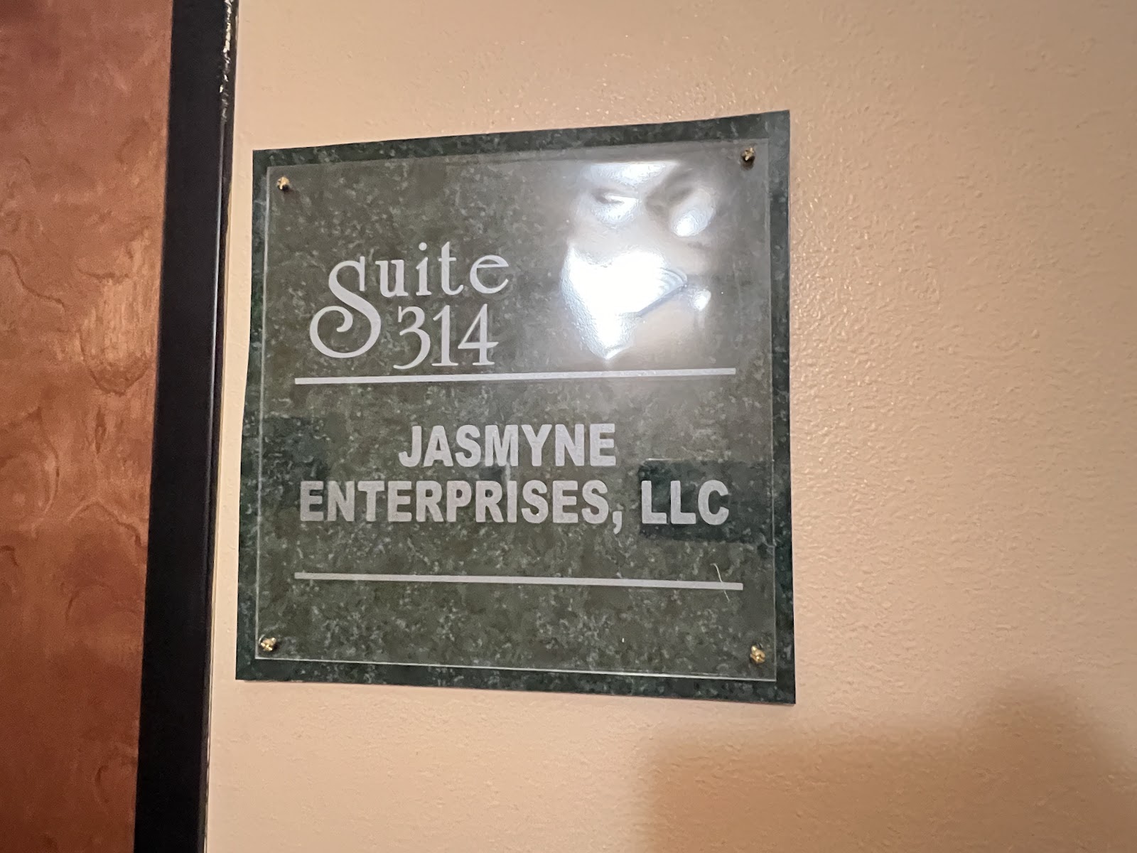 A close-up of a sign on a wall that reads 