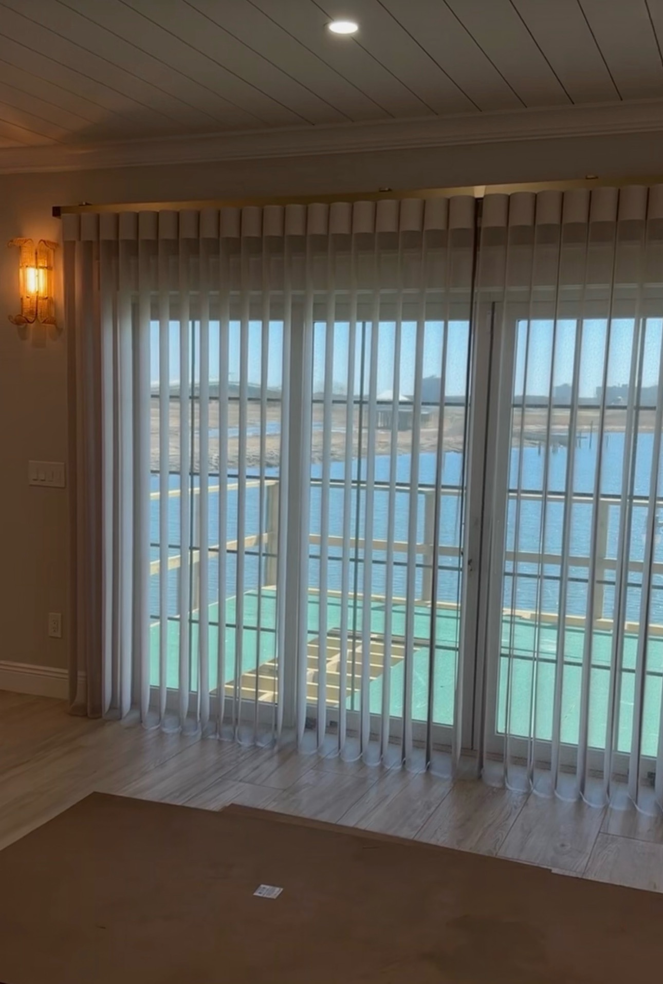 SmartDrape&trade; installed for a sliding door in Astoria by Budget Blinds of Manhattan. Stylish, functional light control with easy walk-through access. Book your free consultation today!