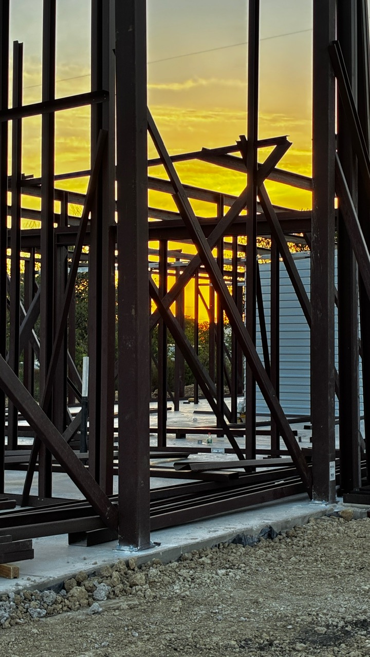Structural steel framework installation for a commercial building project designed and engineered by 