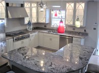 Bianco Antico granite kitchen countertops with a bullnose edge.
