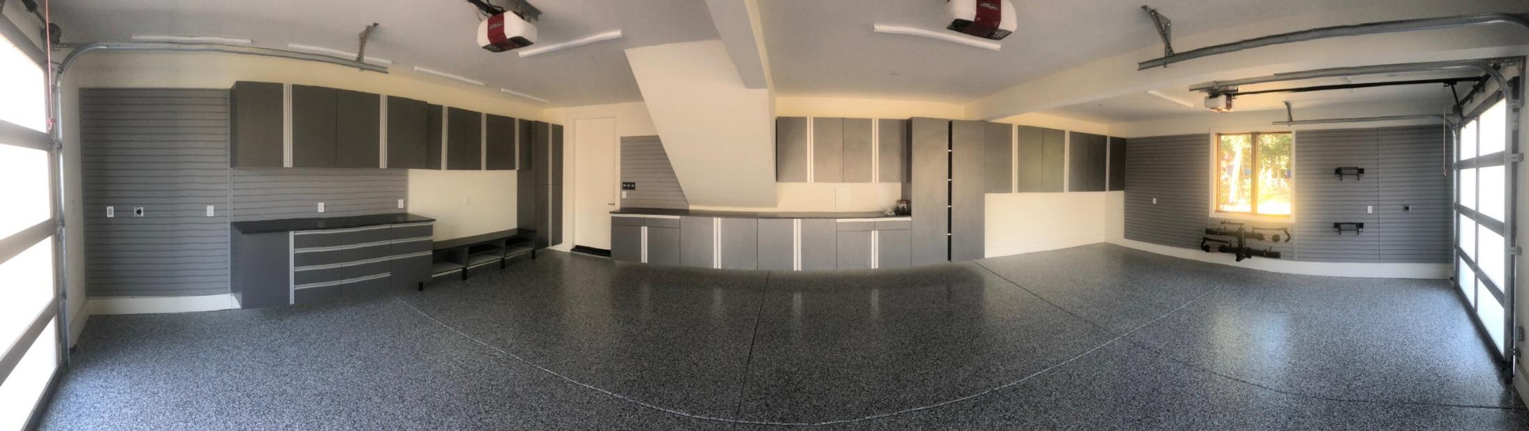 Custom cabinets, countertop, slatwall and epoxy flooring by Premier Garage