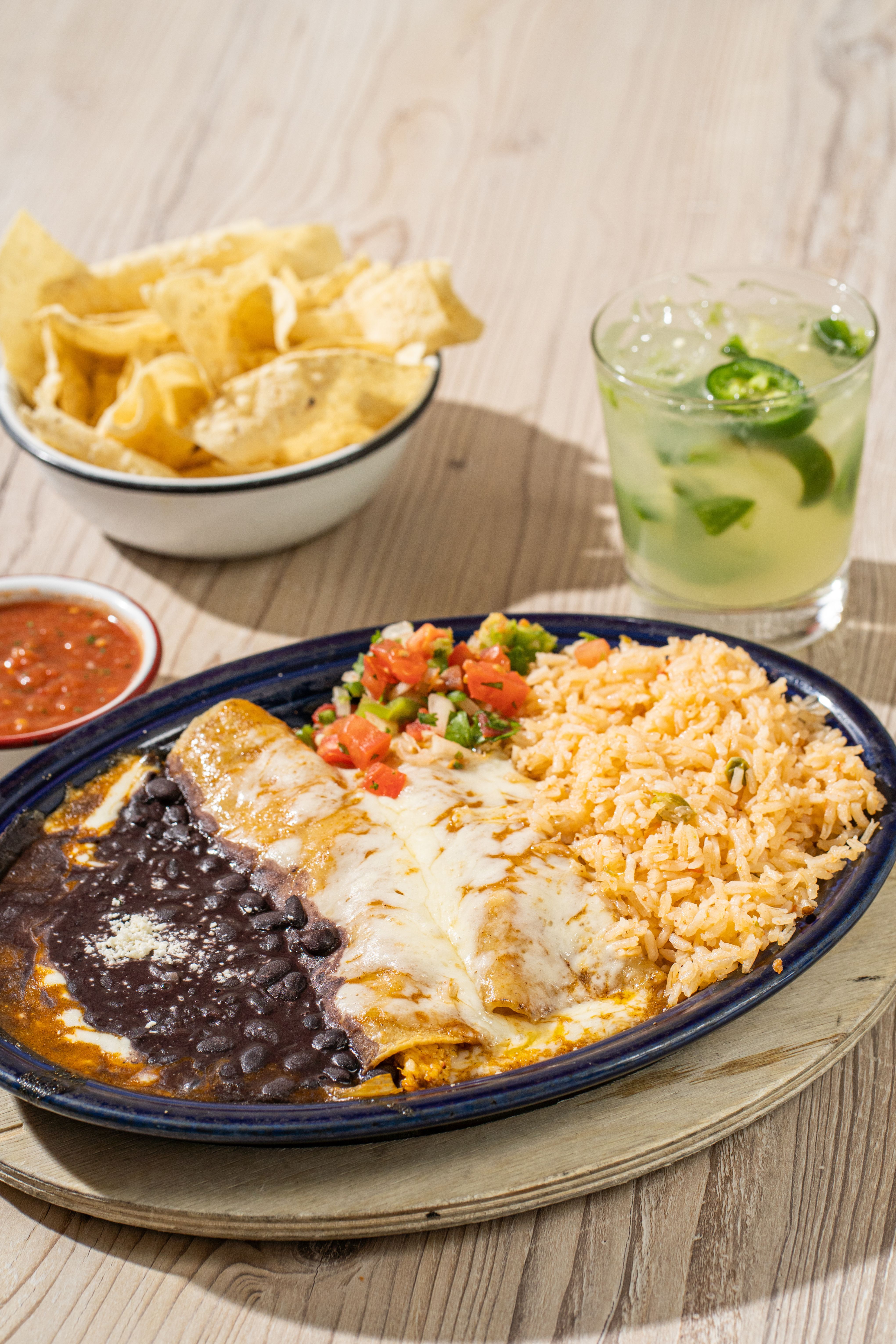 “No, we don’t want a salad.”
We want fresh salsa and chips on the table, queso in reach, flame-grilled fajitas rolling by, burritos covered in green chile, scratch-made tortillas stacked high, and legendary margaritas doing their thing.