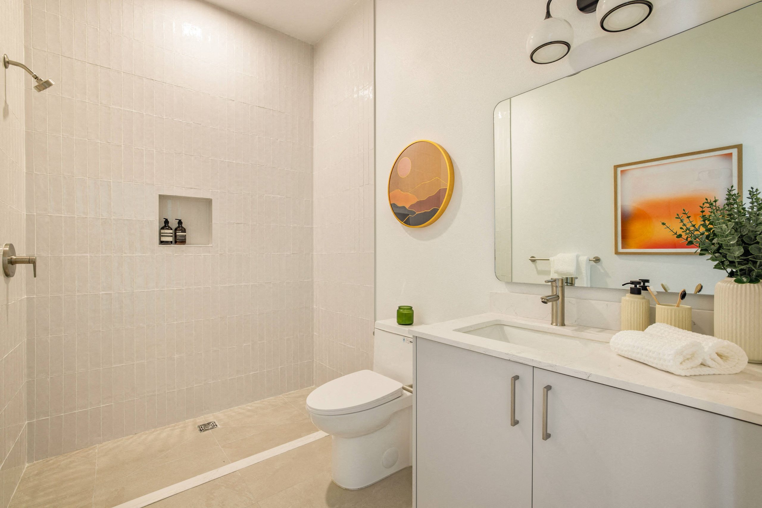 A bathroom with a white toilet and a white sink.