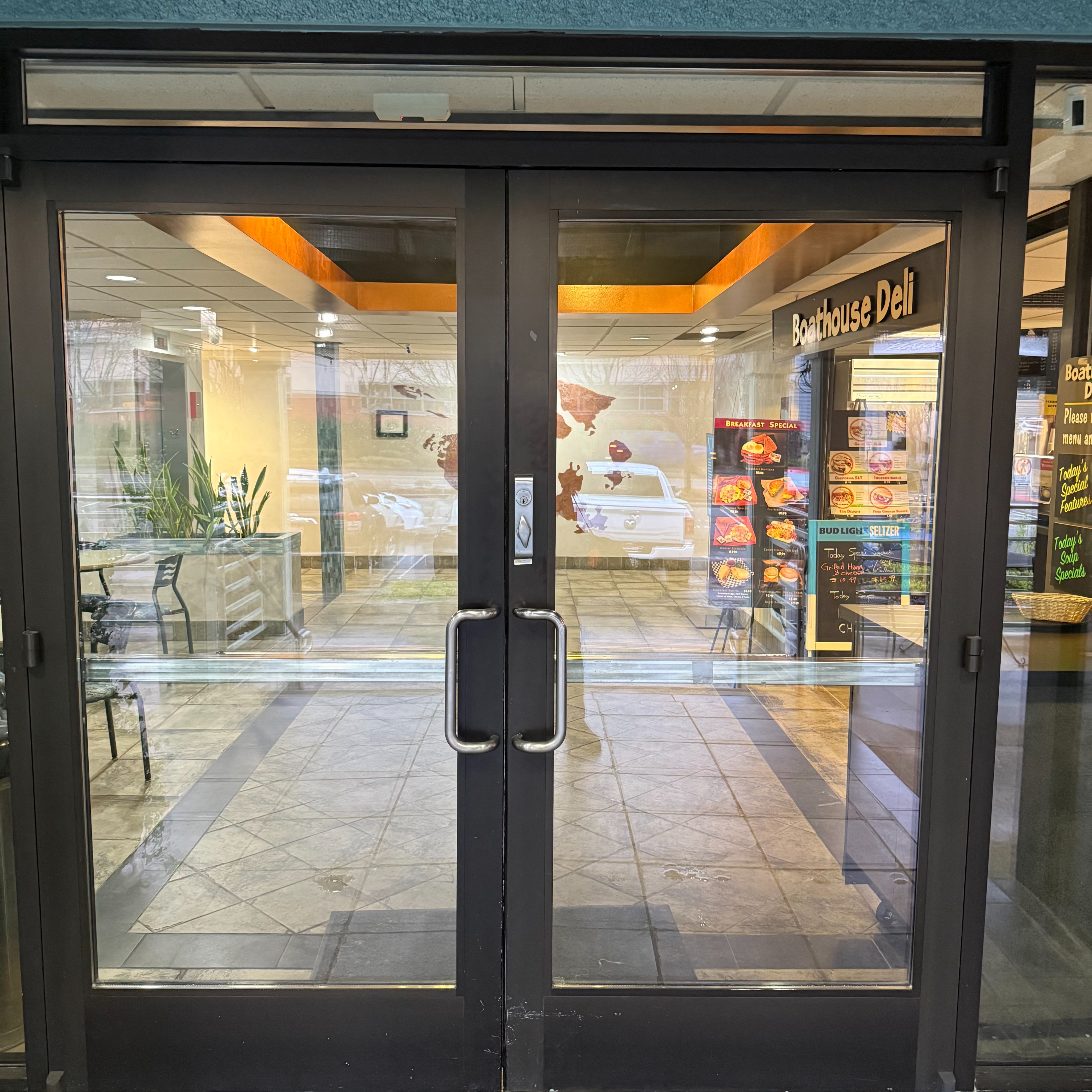 Elevator is on the left as you enter. Coffee shop on right.