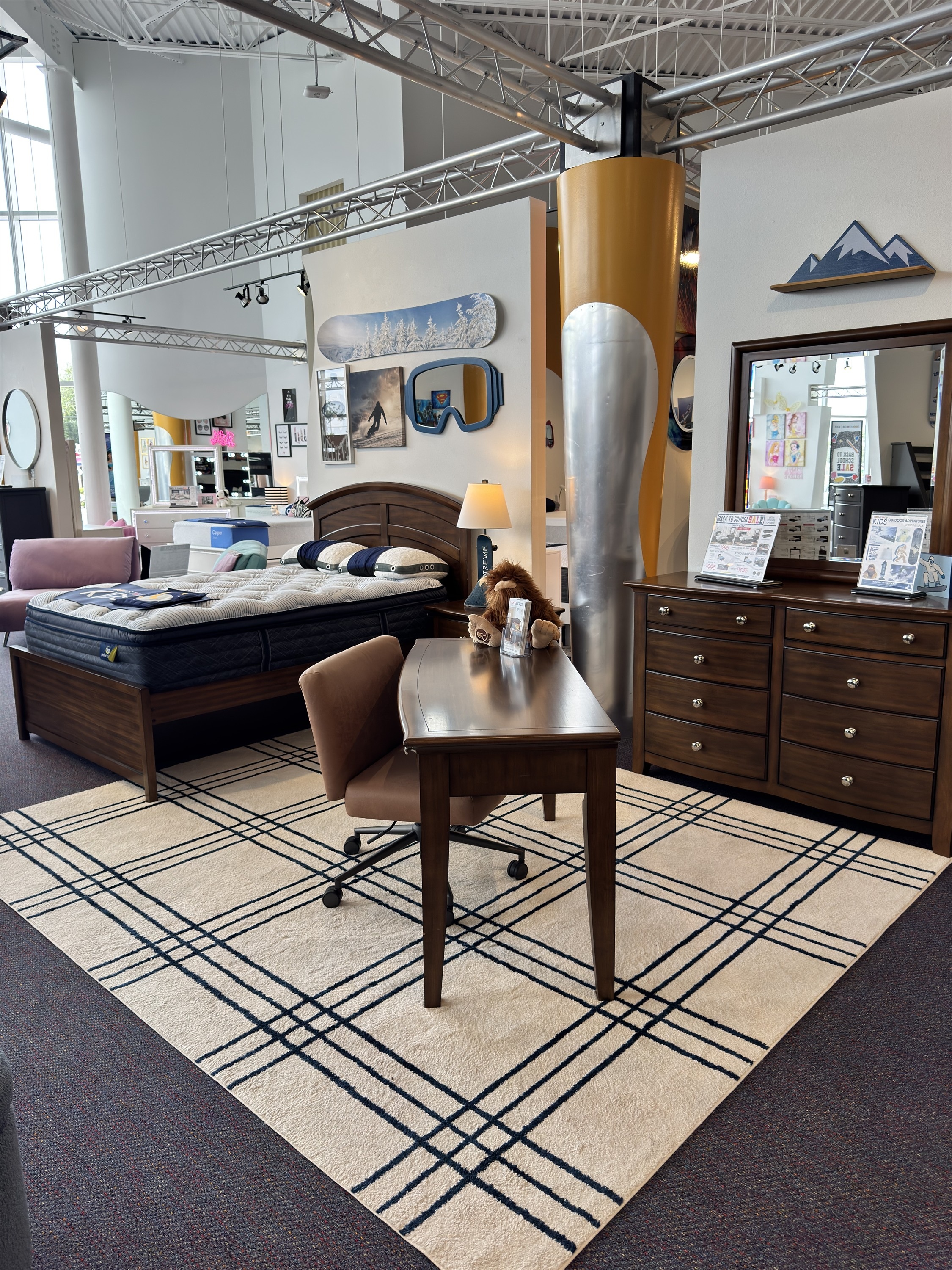 Browse the dark wood kids bedroom set with dresser, mirror, and desk at Rooms To Go Kids in 2026, shown with a snowboard-themed decor package.