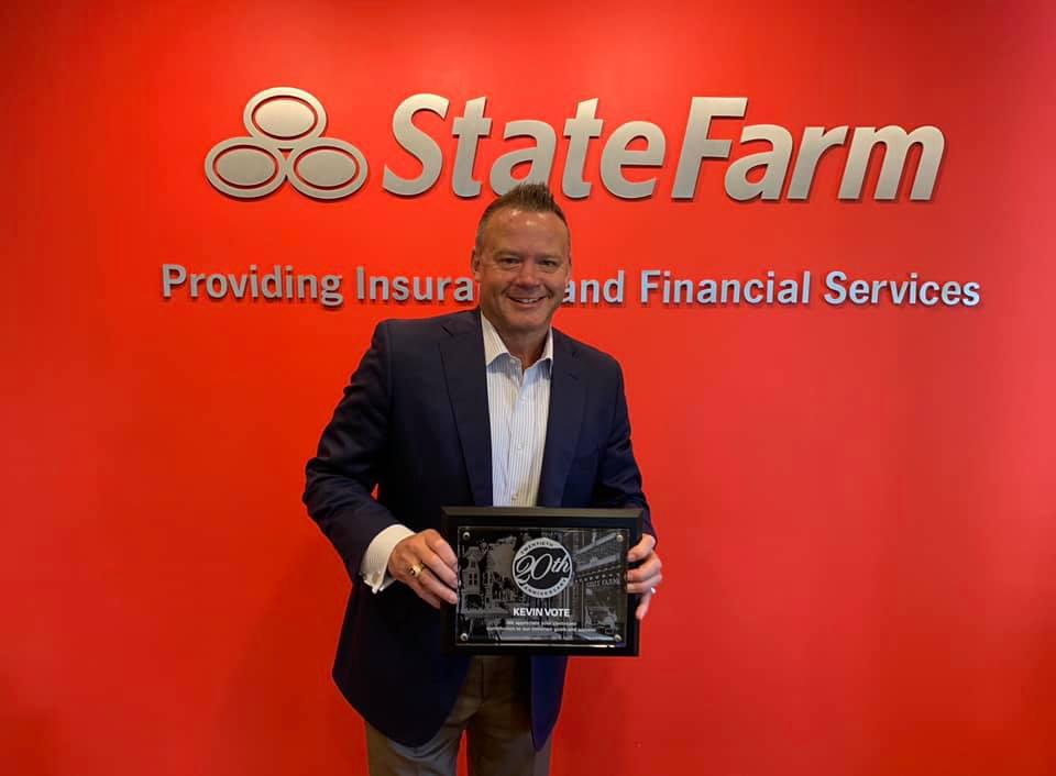 Agent Kevin Vote with his 20 year State Farm award