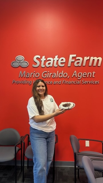 Celebrating the holidays at Mario Giraldo's State  Farm office!