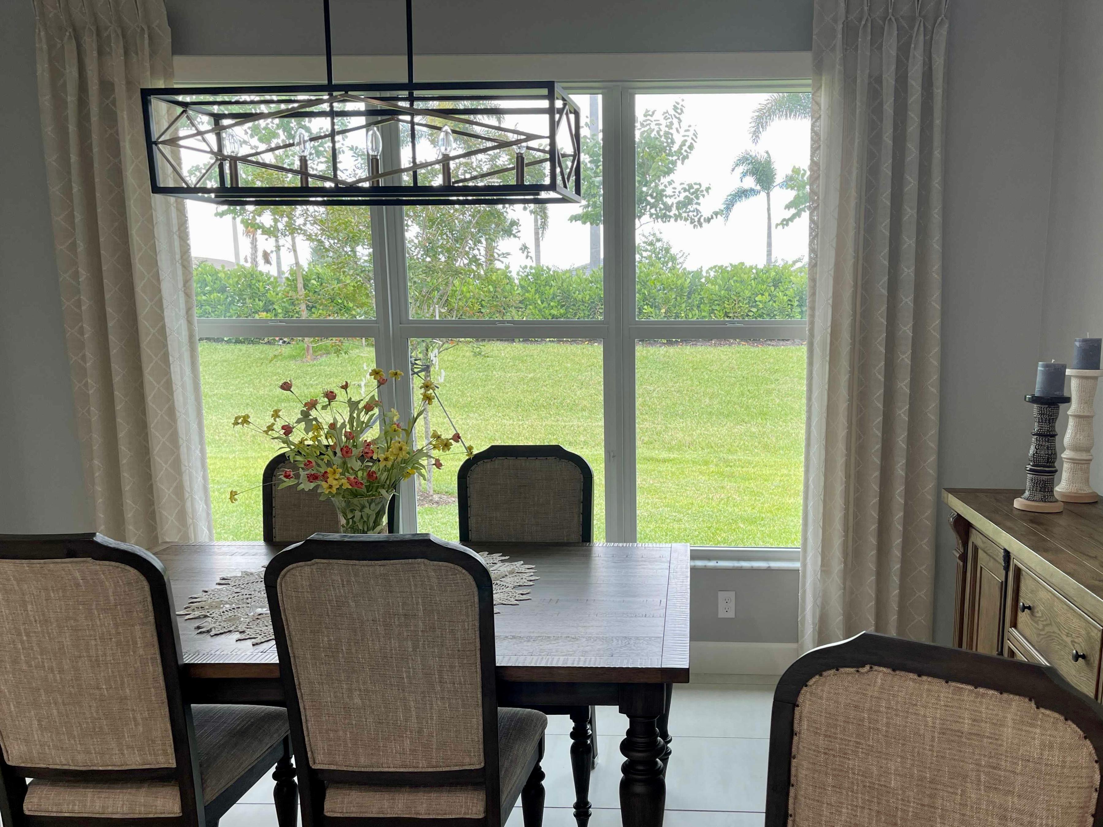 Drapery panels are a perfect way to dress up any window and they provide several useful properties at the same time. These patterned drapes in this Rockledge home work to block heat in the summer and hold in warmth in the winter, all while looking beautiful!