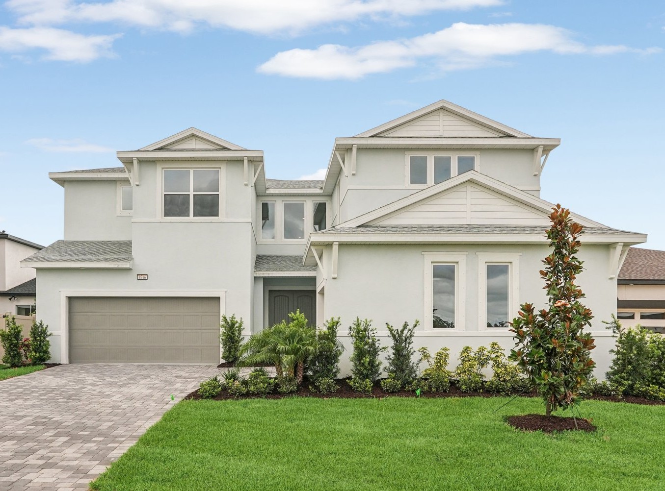 The Front Elevation of a DRB Homes Falcon Home Plan at Biscayne Landing at Seaire in Parrish, FL.