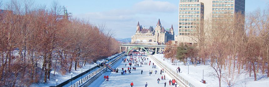 People skating on the frozen surface of the Rideau Canal in the winter.