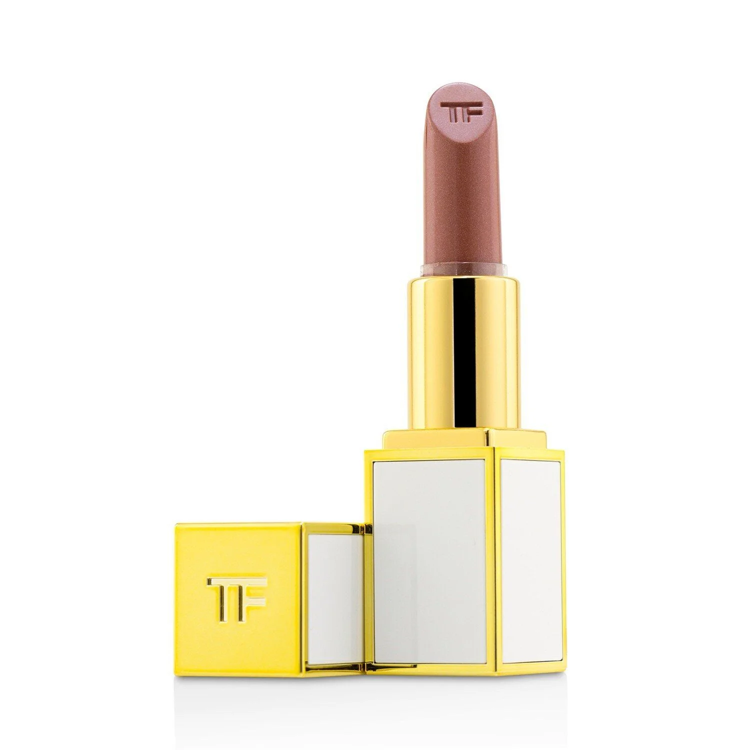 A close-up, isolated studio shot of a Tom Ford lipstick with a nude-pink shade and gold and white packaging. The lipstick bullet has the 'TF' logo embossed on its tip, and the cap, also featuring the 'TF' logo, is open and placed next to the base.