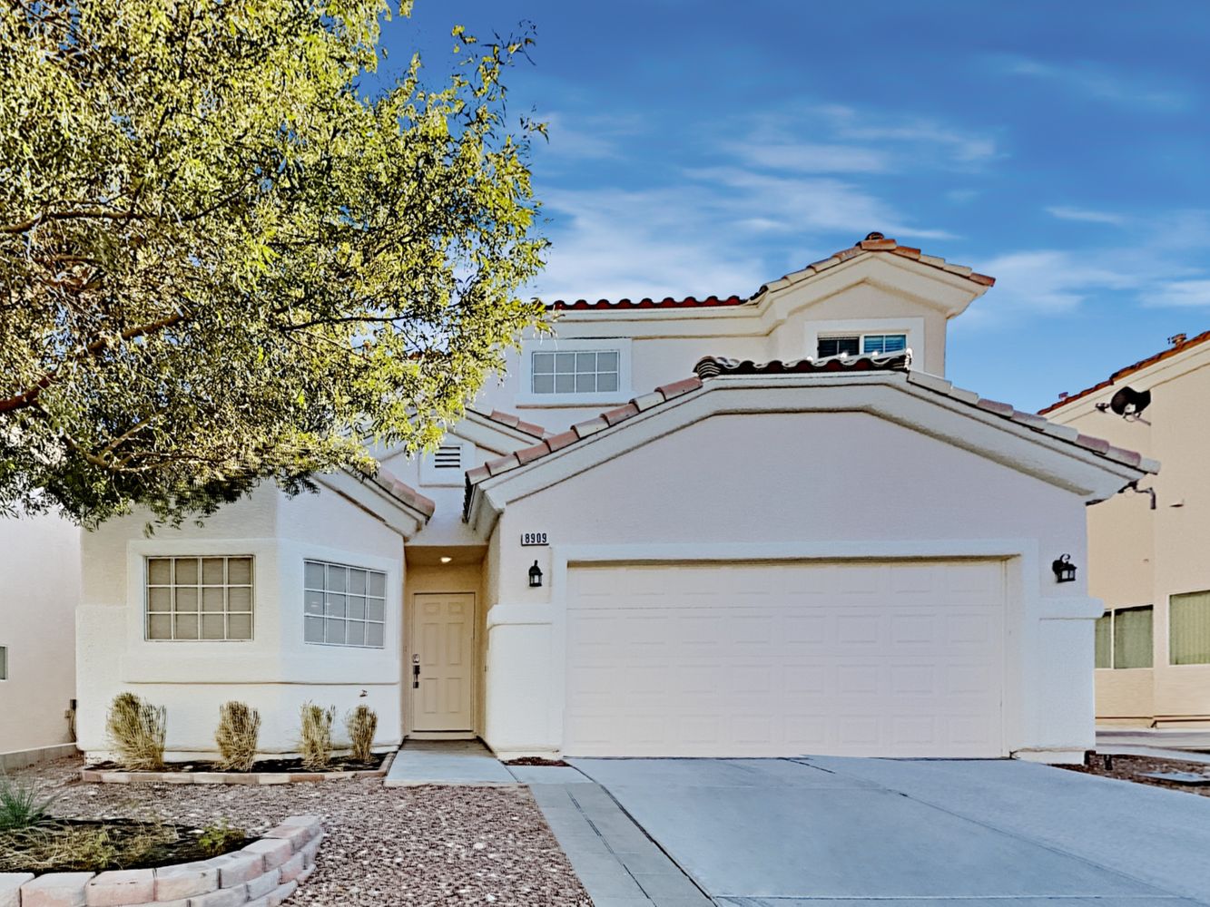 Lovely home with two-car garage and covered porch at Invitation Homes Las Vegas.