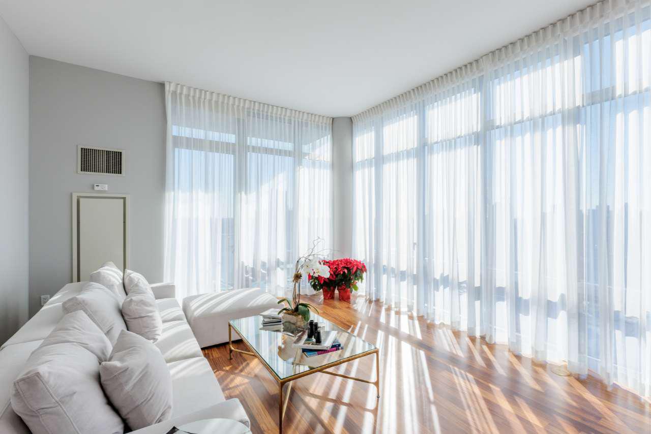 Light-filtering draperies are typically made from fabrics that are not completely opaque but still provide a level of privacy. Materials like sheer or semi-sheer fabrics are common choices for achieving this effect.