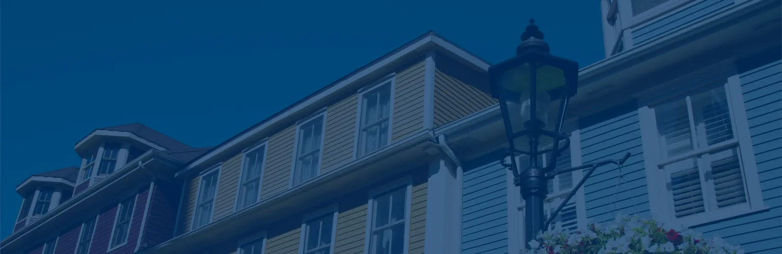 Close-up of a row of colourful Victorian clapboard houses.