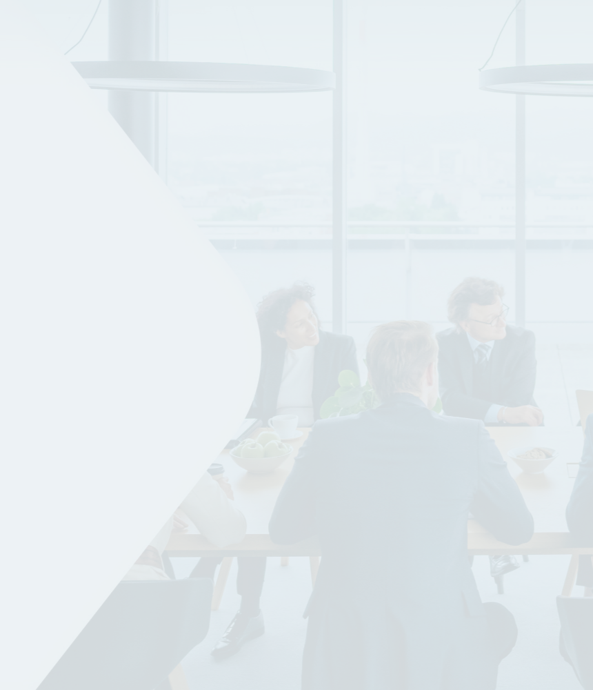 A group of wealth professionals collaborating at a conference table.