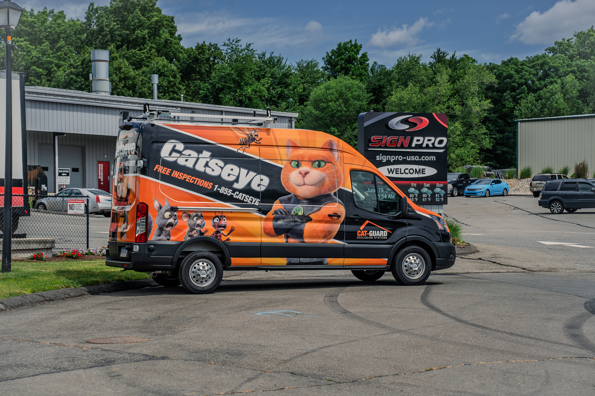 Full vehicle wrap professionally installed by Sign Pro for Catseye Pest Control's Cat-Guard Exclusion Systems, with graphics produced by an outside vendor and expertly applied to a Ford Transit.