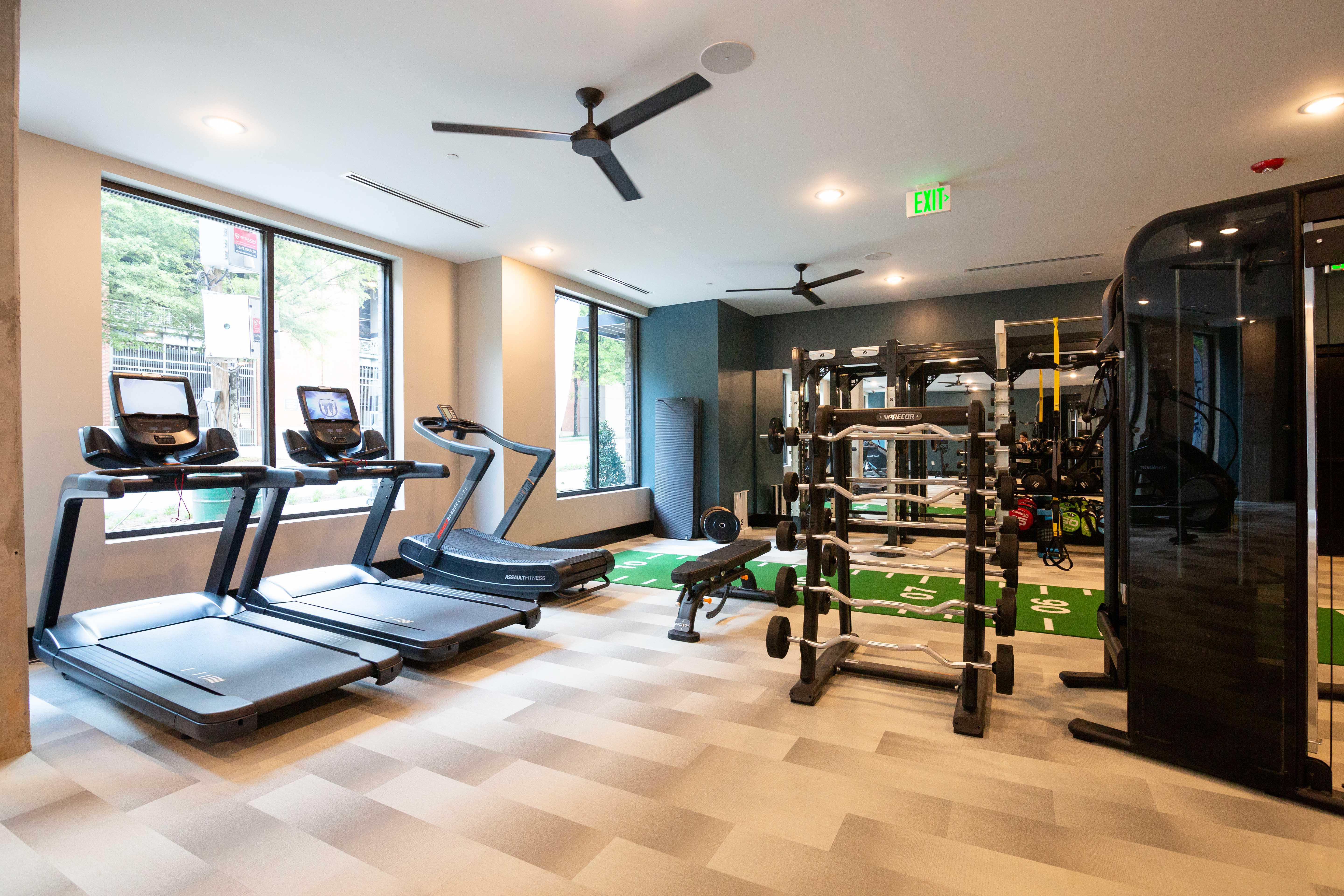 Fully equipped fitness center featuring Precor cardio equipment